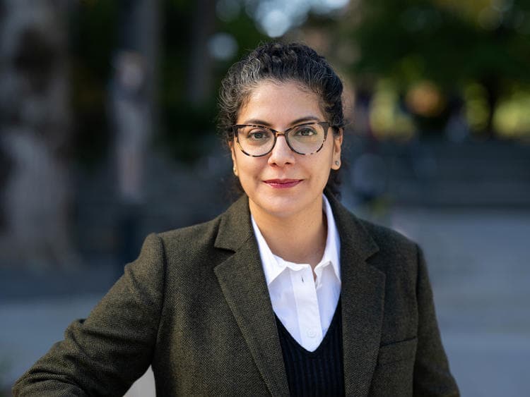 A person in a suit and glasses.