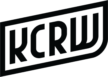 A black logo reading "KCRW" in an outlined shape.