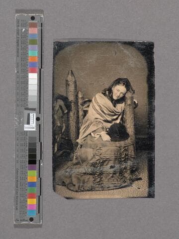 Portrait of unidentified young woman holding hat