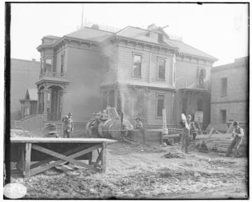 A construction crew working on the construction of the Fourth Street General Office Building