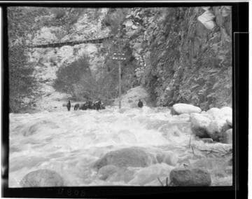 Horsemen along the Santa Ana River transmission line