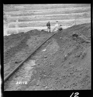 4" iron pipe drain from tile weeper near East end of 11th step