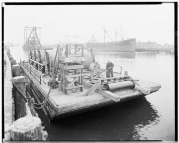 Distribution, Underground - Four reels of sub-marine cable on barge at Proctor & Gamble Plant