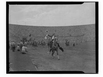 Sheriff Biscailuz riding a horse at Sheriff's Rodeo at the L.A. Coliseum