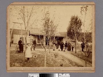 Men, women and children in front of a house, Los Angeles, California