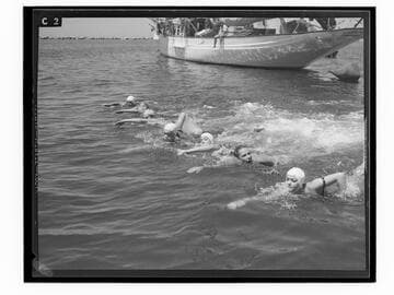 Swimmers in the water at the Yacht Harbor breakwater dedication, Santa Monica