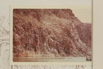 Across the river below the mouth of Separation Canyon showing the area where Powell got rimmed 1869, Aug. and would have dropped into the river had he loosed his hand-hold.  The fiction is obvious