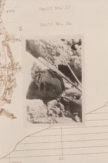 Boat, pole and oar at wreck at Rapid #24.  Coat and oars  pole [sic] 1/25 at 16.  Coat was made by Kellop and Wardner, Idaho.  Belonged to D. W. Hadley