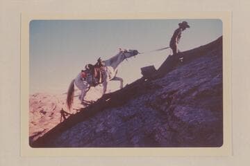 Toby Owl and his horse up the trail between the mouth of Nasja Creek and Dead Center Camp