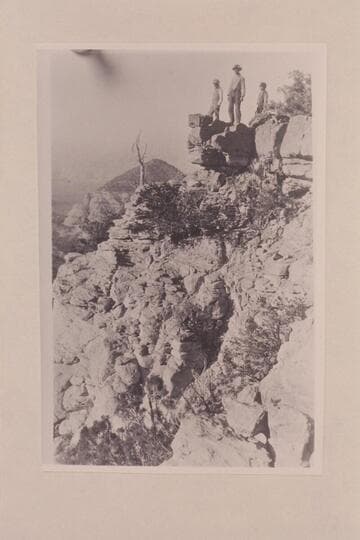 Marks, George and Charley Spencer on ledge of Navajo Mountain near Navajo Begay.  On trek from Oljeto to Lees Ferry