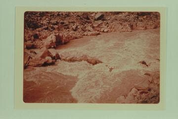 Ulrich Martins running his kayak through the rapid at Mile 231.9