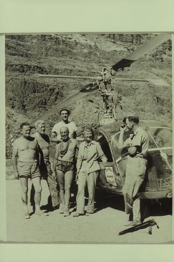 Boat party and helicopter visitors just before the plane left for the Rim from Tapeats Creek.  Left to right:  Taylor, Desloge, Forcier, Marston, Margaret Marston, and pilot "Red" Carson