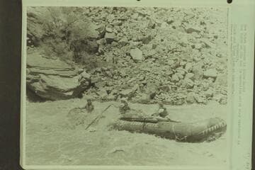 Don Hatch pontoon in Hance Rapid.  Don Hatch at the bow in operation which they designate as coxswain.  Clark and Bruce Lium at the oars