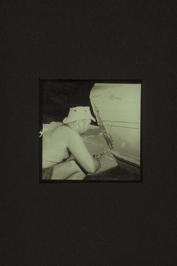 Bill belknap drilling holes in the patch on the CACTUS after she had opened in Tuna Creek Rapid