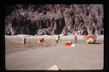 Damaged "Wee Red" on beach; Monument Creek Rapids