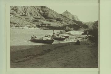 Boats moored at Mile 66 camp;  Temple Butte in distance
