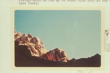 Small arch on skyline, Narrow or Cataract Canyon.  Photographed on run up to about Mile 185.5 at head of Lake Powell