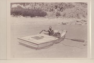 Norm Nevills in the "Wen" after running Dark Canyon Rapid