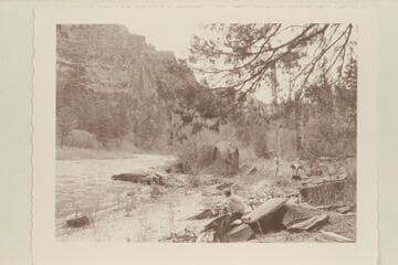Camp, Dolores River.  Margaret Marston at booking nearest the camera.  Pres and Becky Walker in background.  [on photo reverse:  "near Beaver Creek"]