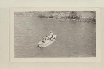 The start of the boat trip down the Dolores River.  Dolores, Colorado. Left to right, boat in stream:  Becky Walker, Pres Walker at the oars, Marston and Margaret Marston
