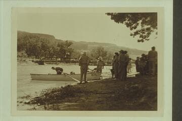 Preparing to leave town of Gateway, Colorado, during traverse of Dolores River.  Pres Walker is in the punt and Marston holds it from the shore