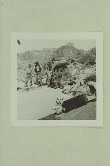 L.Q. Jones (playing Bill Hawkins) brings in a stuffed deer.  David Stollery is at left in character of Andy Hall.  Stan Jones is Senaca Howland.  Bob Armstrong is next to Hawkins, playing Oramel Howland