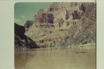 John Daggett floating downriver just above Bedrock Rapid