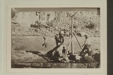 Emery and Tasker.Salvage operations to recover boat trapped in rocks at Dark Canyon Rapids.  USGS party directed by W. R. Chenoweth.  In LaRue album #1 the credit is to L. Lint.  "Ready to Go Out," Lint Album.  Copy of small print loaned by Chenoweth