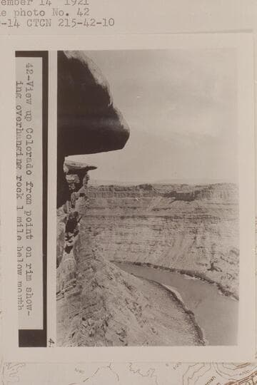 Up Cataract Canyon from approximately Mile 215 1/2.  View up Colorado from point on rim showing overhanging rock 1 mile below mouth