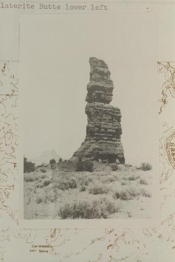 The Totem Pole.  Triangulation Station M.  Moencopie outlier on Coconino Sandstone.  Elevation of top:  5788 ft.  Green River Desert.  Elaterite Butte lower left