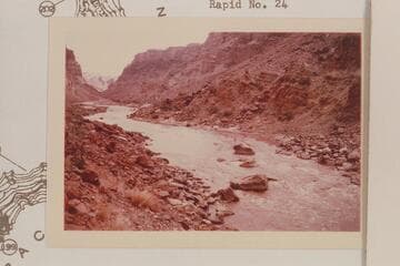Up river to the large boulders at the head of Rapid No. 22.  At the low water shown the rapid is in two sections.  Visbak capsized his Sportyak at the large boulder near the right bank