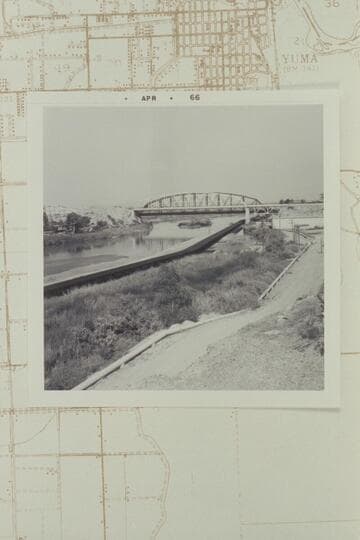 From foot of Madison Avenue on hilltop looking east upstream