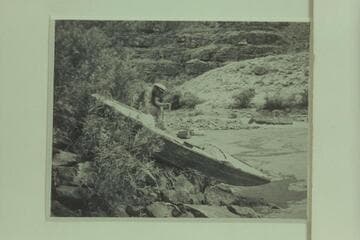 Buzz Holmstrom examines the abandoned "Illinois Girl" left in the Canyon of Ladore by Tony Backus