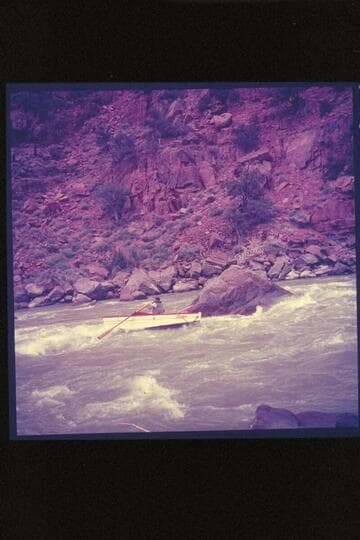 Lug Larsen in the "Galloway," passing the rock at lower end of Disaster Rapid