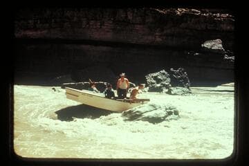 George Wing hung with San Juan punt on rock near Johns Canyon.  MH gauge:  1190 cfs