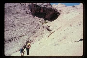 Climbing out of gorge below bridge near Baker's Ranch