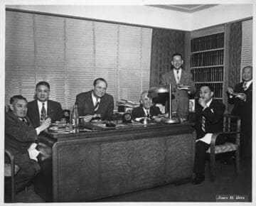 William Knowland and group eating in Y. C. Hong's office