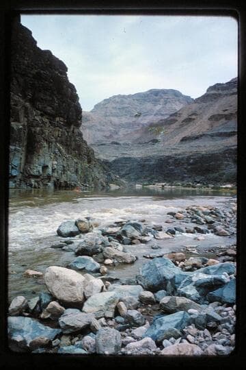 Up at head of 217 Mile Rapid, Chopper over earth