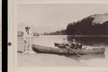 George C. Fraser, Dave Rust, Sarah Fraser in Dave Rust's canvas folding boats at camp near Hole-in-the-Rock.  Mile 84; Glen Canyon