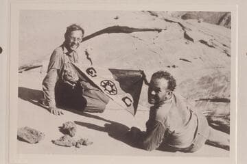 George Stone and Dr. Frazier with Explorer flag on top of Rainbow Bridge
