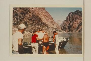 Jim Jordan directs the job of lifting the injured Komie into the Circle boat at the foot of 231 Mile Rapid