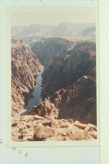 Upriver from directly above Grapevine Rapid.  Route of Spur Trail appears.  The sun lights the saddle