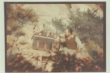 Bertie Graves' trunk at the Music Temple in Glen Canyon is examined by Harry Aleson