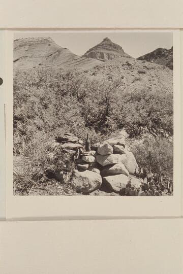 Monument on right bank of Chuar Creek.  Bottle was inside.  West side of Chuar Creek just north of Butte Fault.  Nine workings are west and south of this monument about 100 yds.  In area of Morning Star Mine and Rogers Claim
