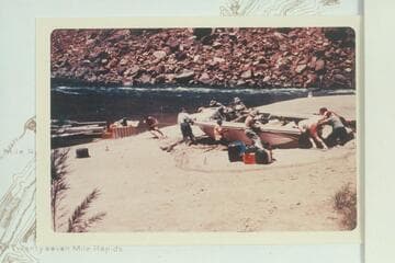 Dragging the inboard-outboard into the river from the beach at Mile 22 after repair to the outboard unit