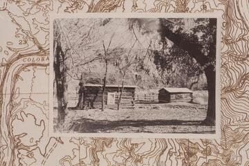 Lee's cabin and blacksmith shop on the Lee ranch