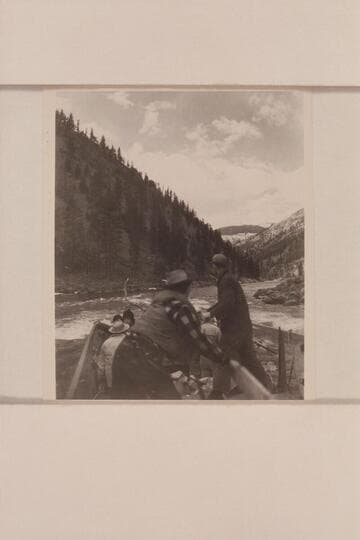 Carl Kriley and Don Smith swing the sweeps of the scow