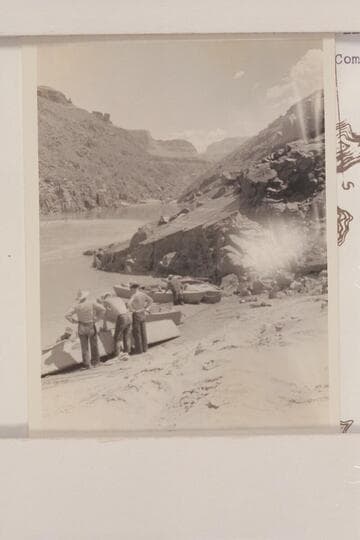 Upriver at head of Serpentine Rapid.  Mile 105.95.  Bright Angel gauge:  2650 cfs.  Eddy lost 12 films of the 4x5 size covering Serpentine to camp below Elves Chasm.  This may be Eddy's photo 17-2, captioned "Repairing boat."