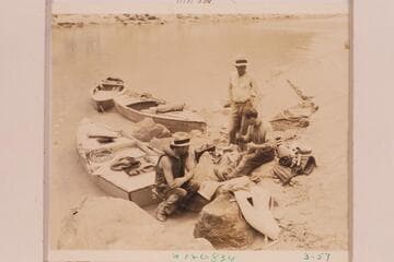 Jayne cleans the photographic equipment after the capsizing in 22 Mile Riffle