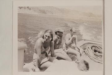 Anne Desloge, Al Milotte and ?, riding down Lake Mead after 1947 run of the Grand Canyon
